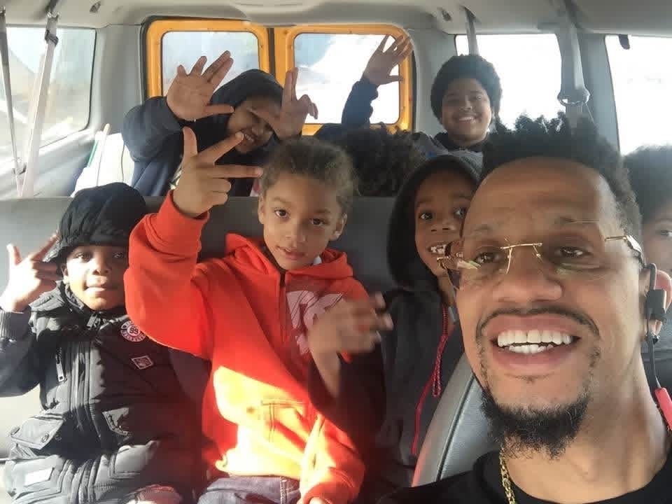 Children and volunteers in a van during the Pressure Built Holiday Hope Christmas Program